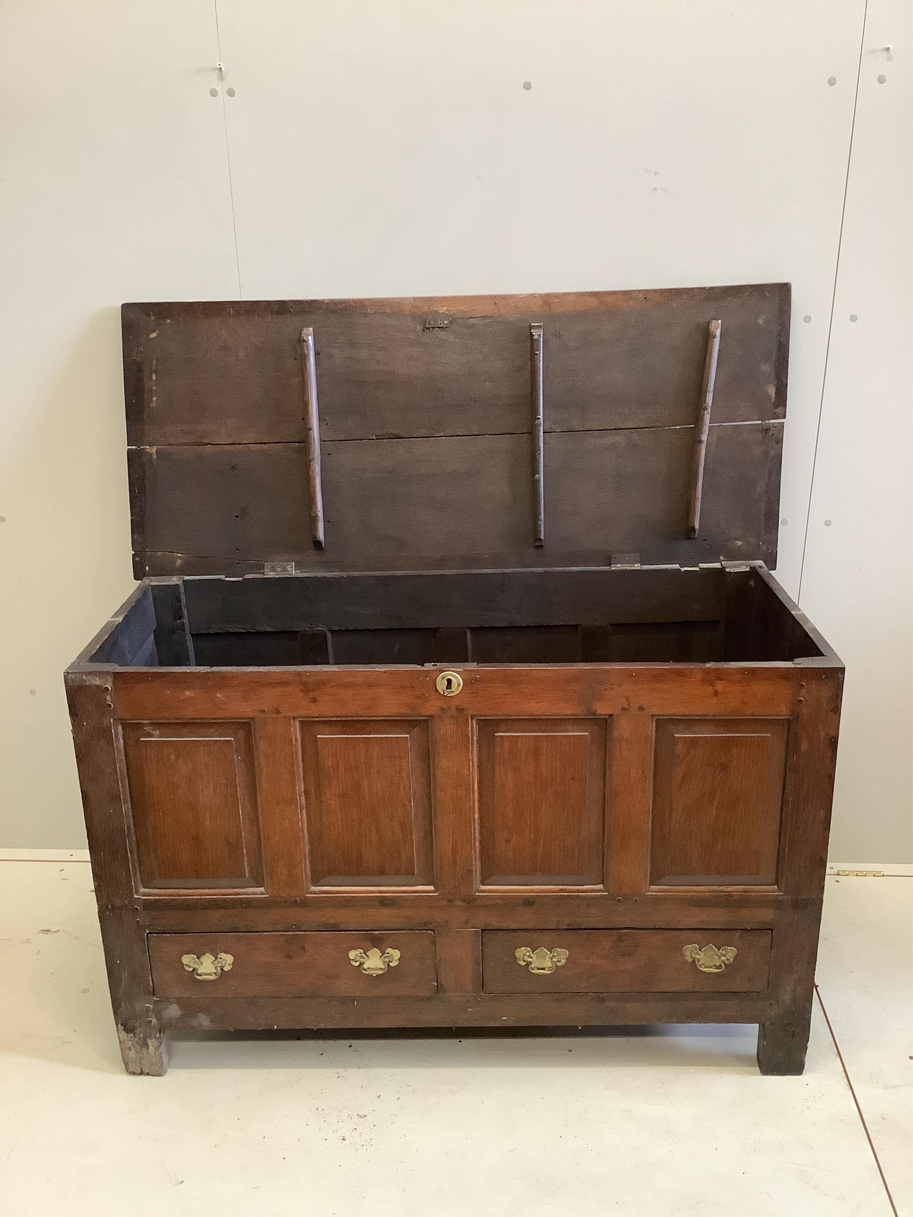 A mid 18th century panelled oak mule chest, width 136cm, depth 58cm, height 87cm. Condition - fair